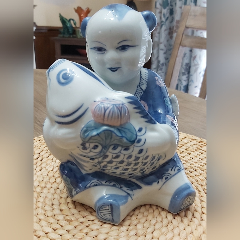 Asian boy with koi fish